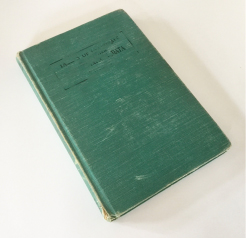 Worn green book cover